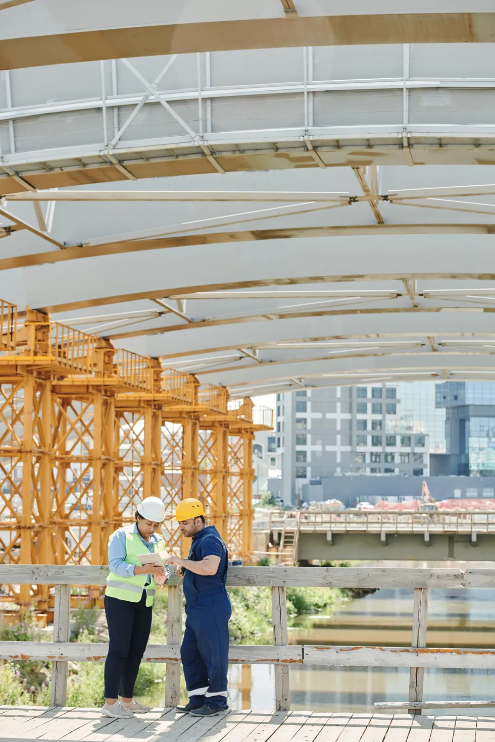 Tradespeople reviewing plans on site